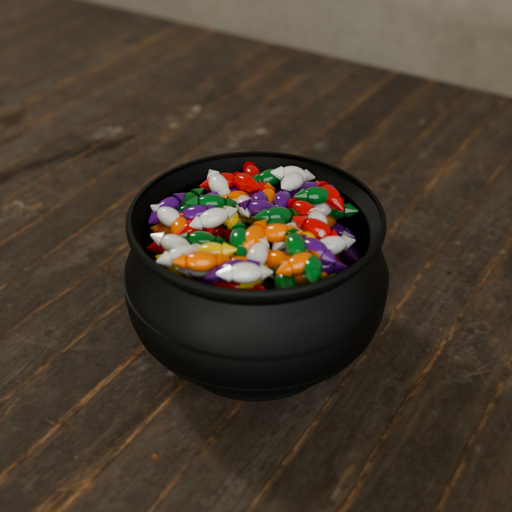 Cauldron Candy Dish in Matte Black PLA, filled with wrapped candy on a dark wooden table