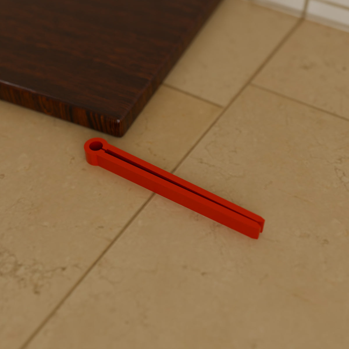 Chip Bag Clip (110 mm) in Bright Red PETG, on a kitchen counter