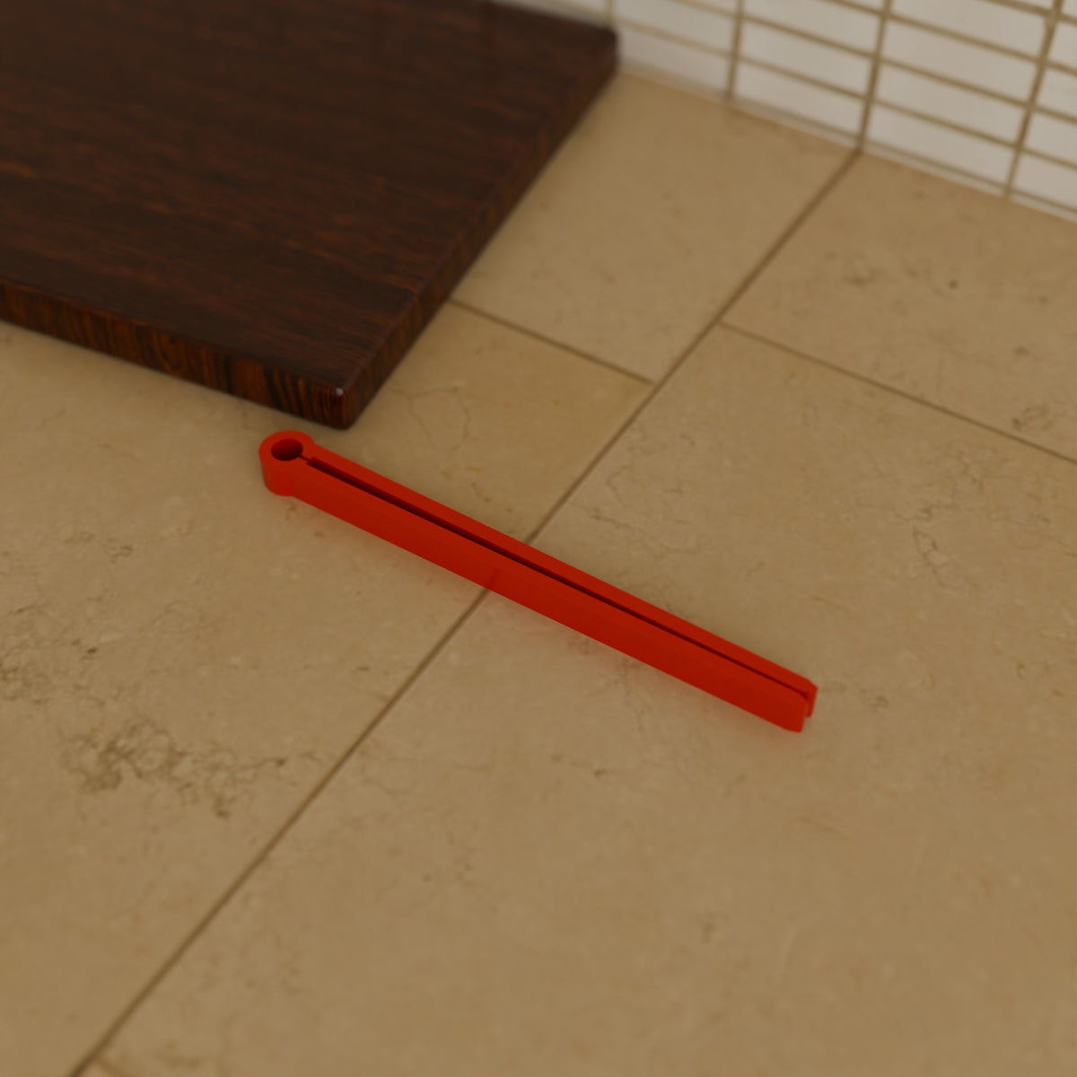 Chip Bag Clip (150 mm) in Bright Red PETG, on a kitchen counter