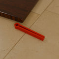 Chip Bag Clip (80 mm) in Bright Red PETG, on a kitchen counter