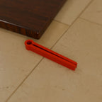 Chip Bag Clip (80 mm) in Bright Red PETG, on a kitchen counter