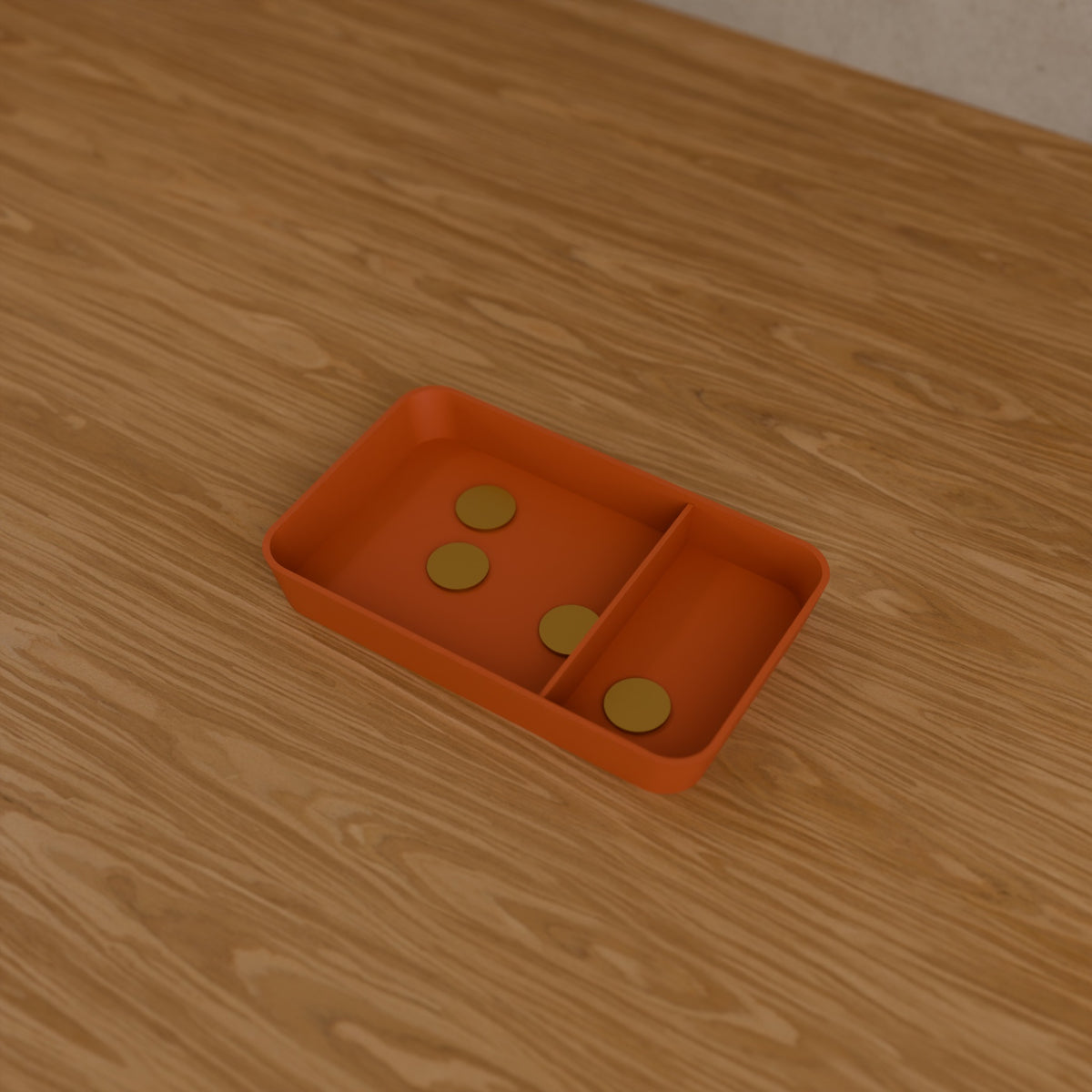 Desk Catch-All Tray in Matte Terracotta PLA, holding coins on a wooden desk