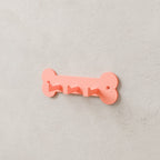 Dog Leash & Collar Rack in Matte Coral PLA, mounted on a wall