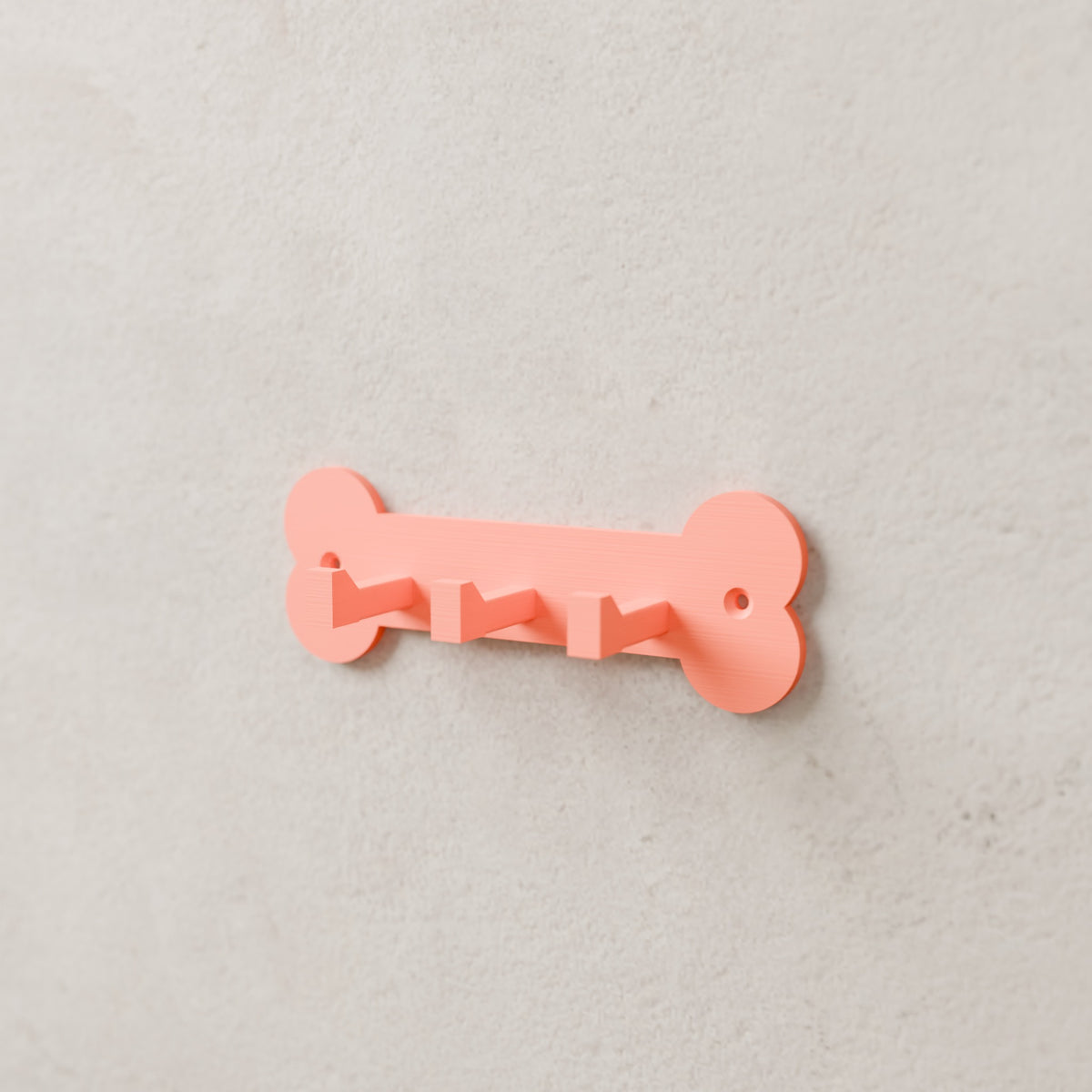 Dog Leash & Collar Rack in Matte Coral PLA, mounted on a wall
