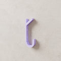 Double Coat Hook in Matte Lavender PLA, mounted on a wall