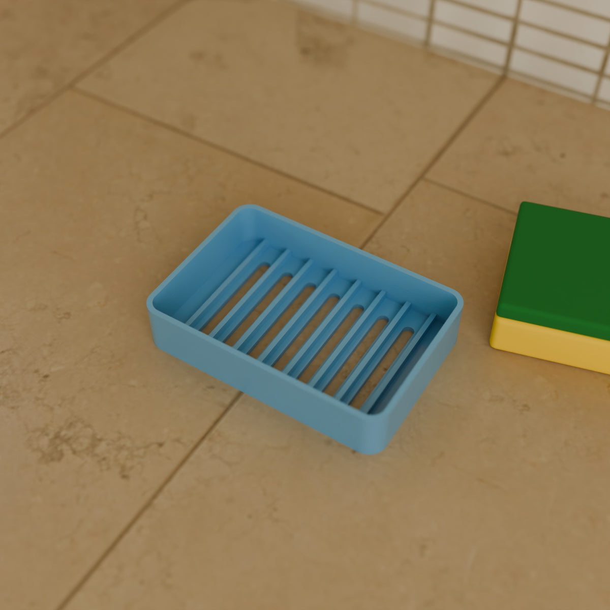 Draining Sponge Holder in Matte Sky Blue PETG, next to a sponge on a kitchen counter