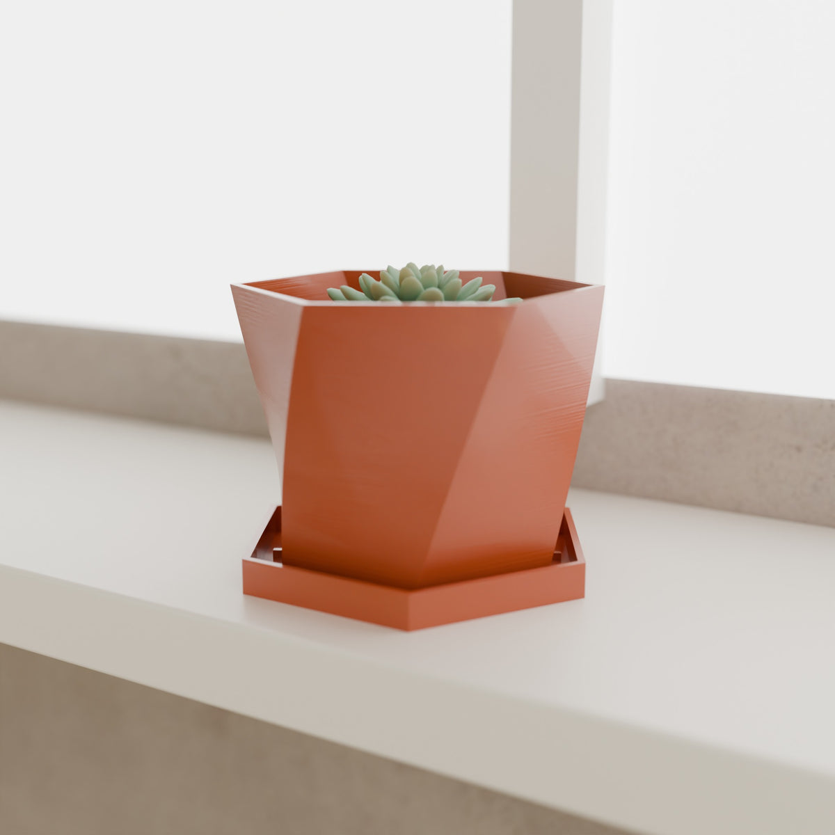Geometric Planter with Saucer in Matte Terracotta PETG, with a succulent on a windowsill