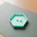 Hex Dice Rolling Tray in Matte Teal PLA, with dice on a game mat