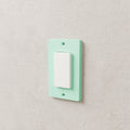 Light Switch Cover Plate (Decora / rocker) in Matte Mint PLA, on a wall around a rocker switch
