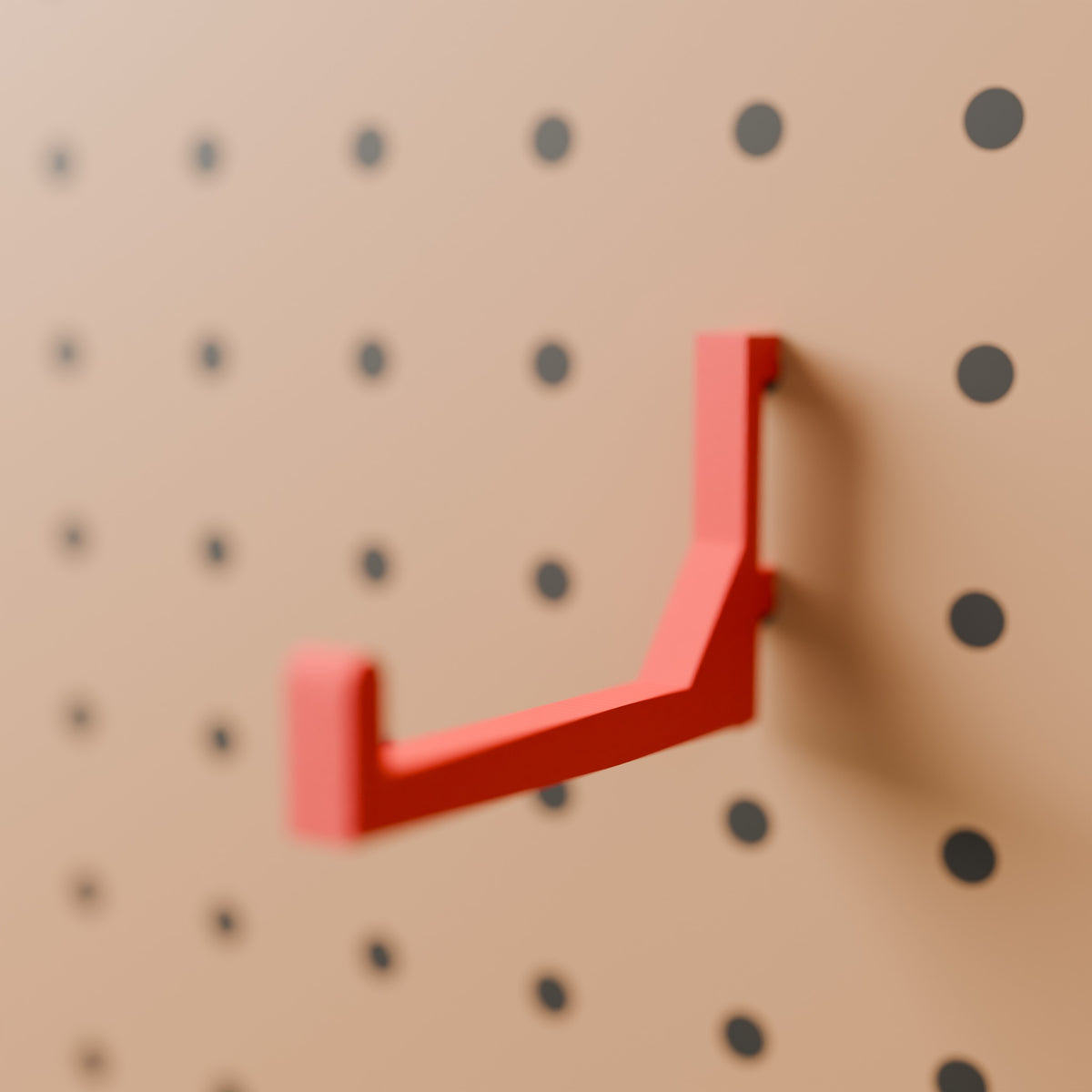 Pegboard Hook (75 mm reach) in Bright Red PLA, on a pegboard