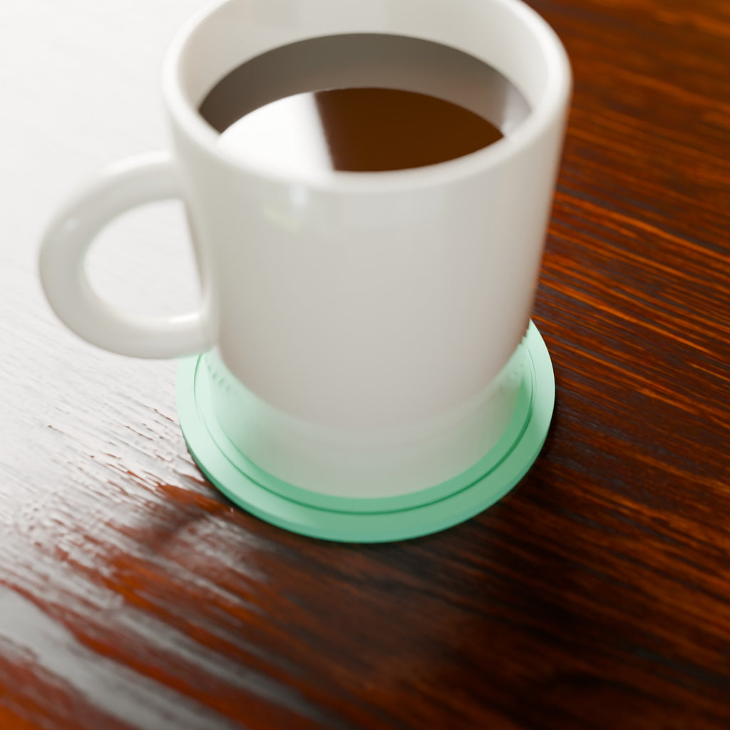 Ripple Ring Coaster in Matte Mint PLA, under a coffee mug on a wooden table