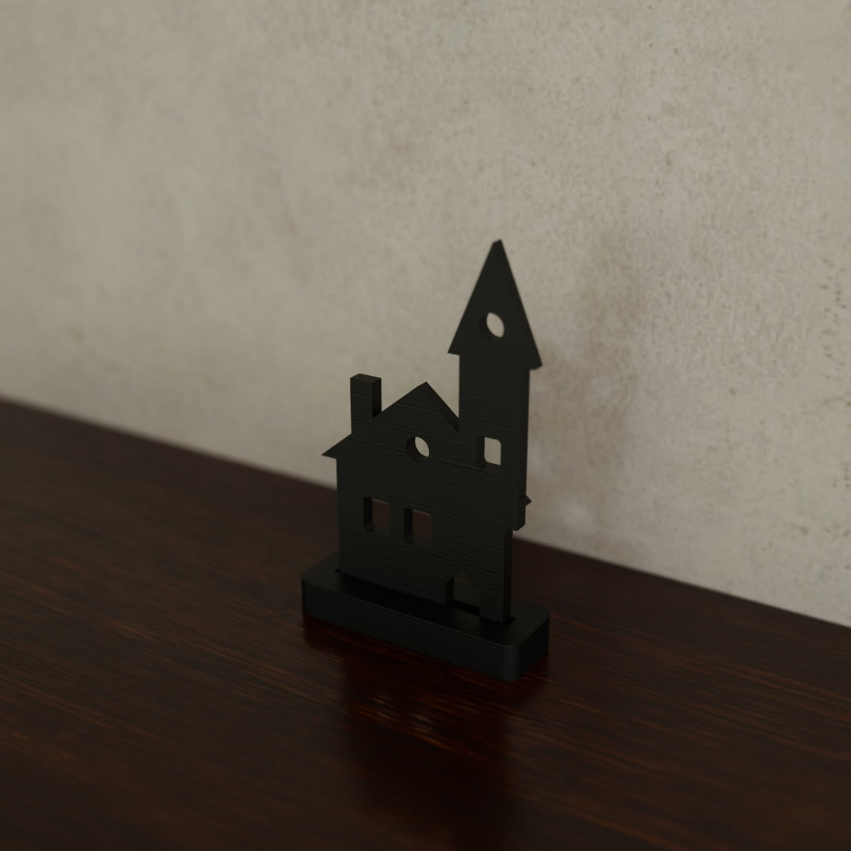 Spooky Silhouette Shelf Sitter (Haunted house) in Matte Black PLA, on a dark wooden shelf