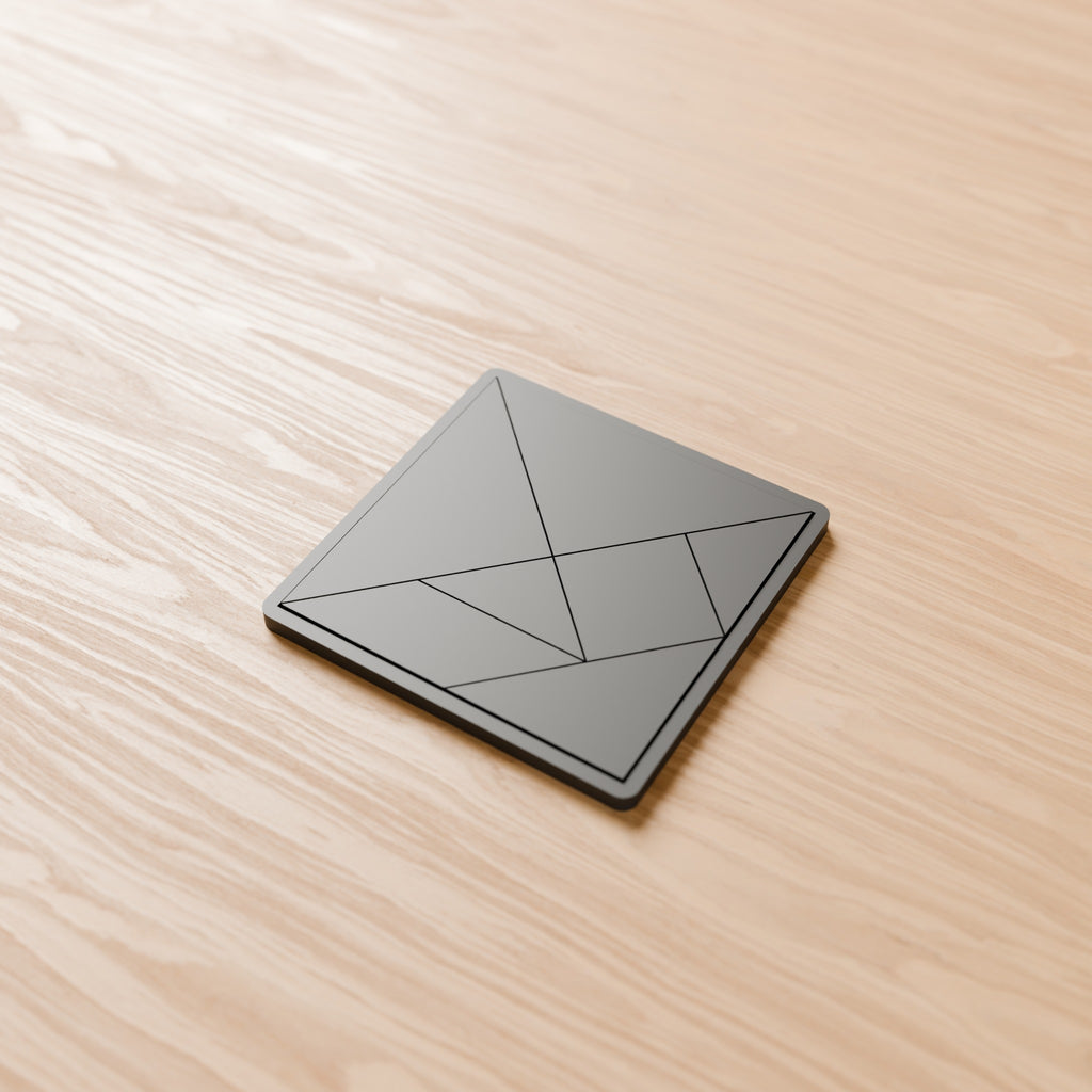 Tangram Puzzle with Frame in Matte Charcoal PLA, on a wooden table