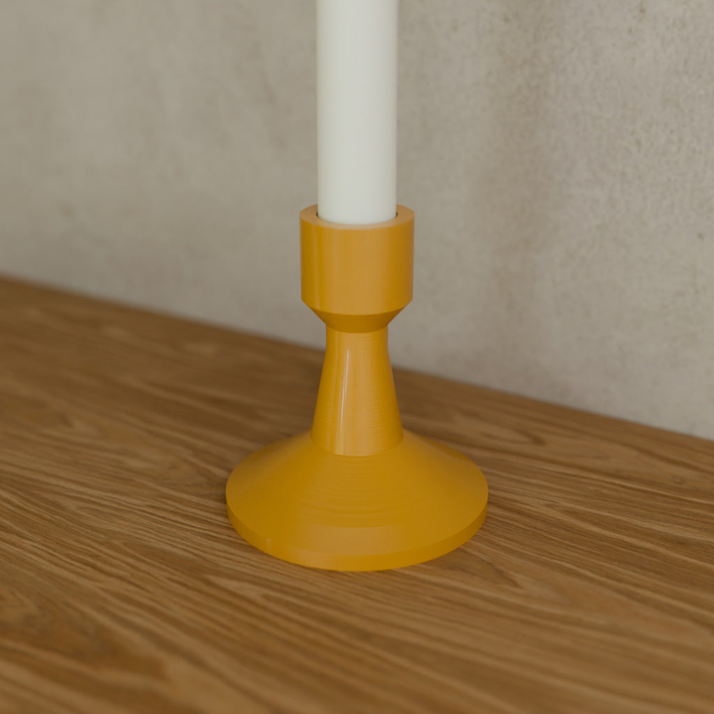 Taper Candle Holder in Matte Mustard PETG, holding a taper candle on a wooden shelf