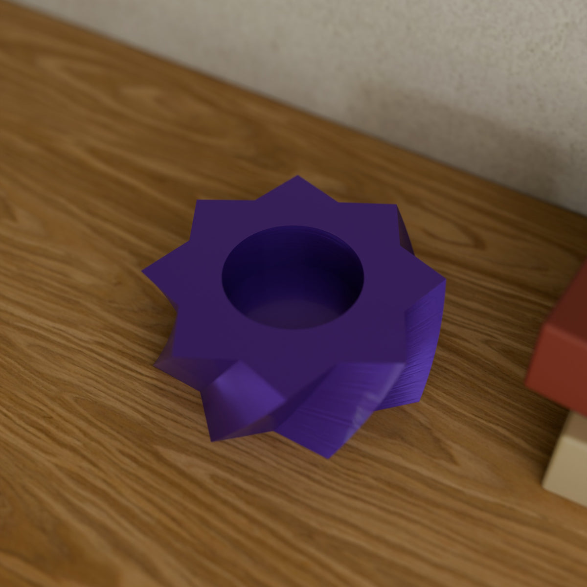 Twisted Star Tealight Holder (Short 30 mm) in Silk Purple PETG, on a wooden shelf