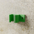 Wall Tool Clip (Broom/Mop Holder), 20 mm handle version, in Bright Green PETG, mounted on a wall